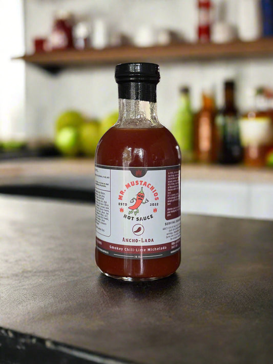 Bottle of hot sauce with a label on a wooden surface
