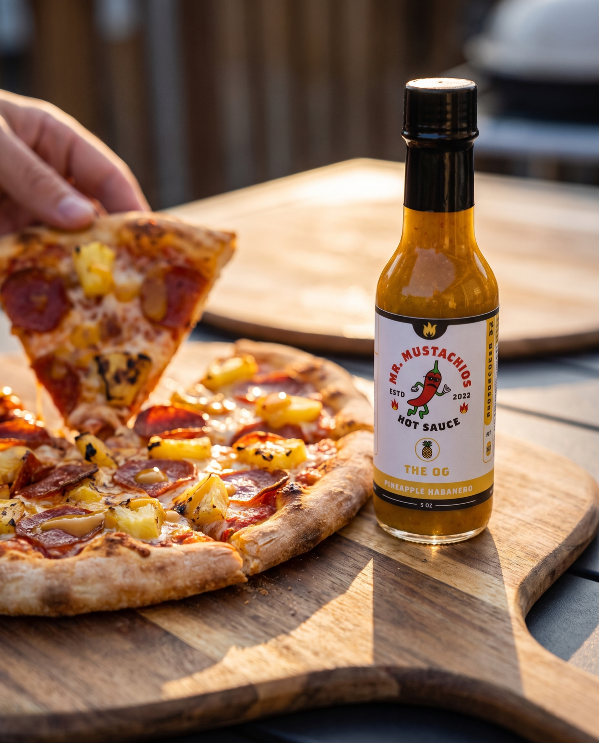 The OG pineapple habanero hot sauce with pepperoni and pineapple pizza